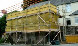 Scaffolding on old building above