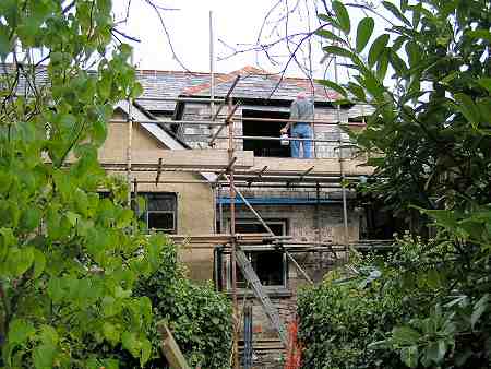 The rear of the Finch Foundry cottage being restored by skilled craftsmen