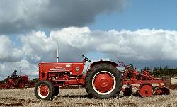Red tractor on skyline