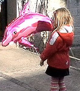 Girl with dolphin balloon
