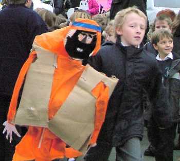 Lad rushing with Joseph puppet