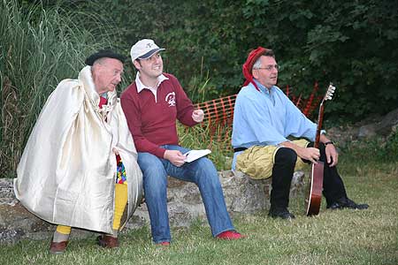 Cast in costume watching